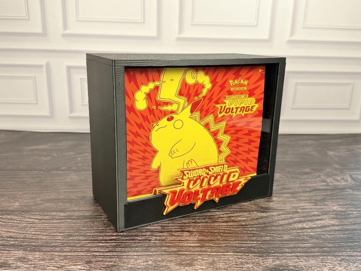 Vivid Voltage ETB display case with Pikachu artwork box