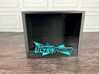Ultra Prism ETB display case with turquoise raised logo plate