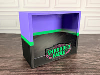 Shrouded Fable purple green black ETB display case angled view