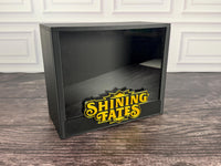 Black Shining Fates ETB display case, angled view with raised gold logo